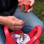 A man connecting a propane gas bottle