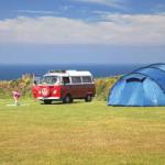 Volkswagen Campervan and tent at a campsite