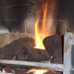 A roaring fire using peat fire logs