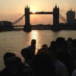 People watching the sunset on the Thames in London