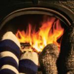 People warming their feet by the fire