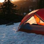 Tent by a forrest in snow