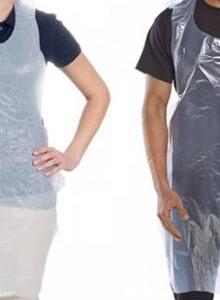 A man and a woman wearing plastic disposable aprons